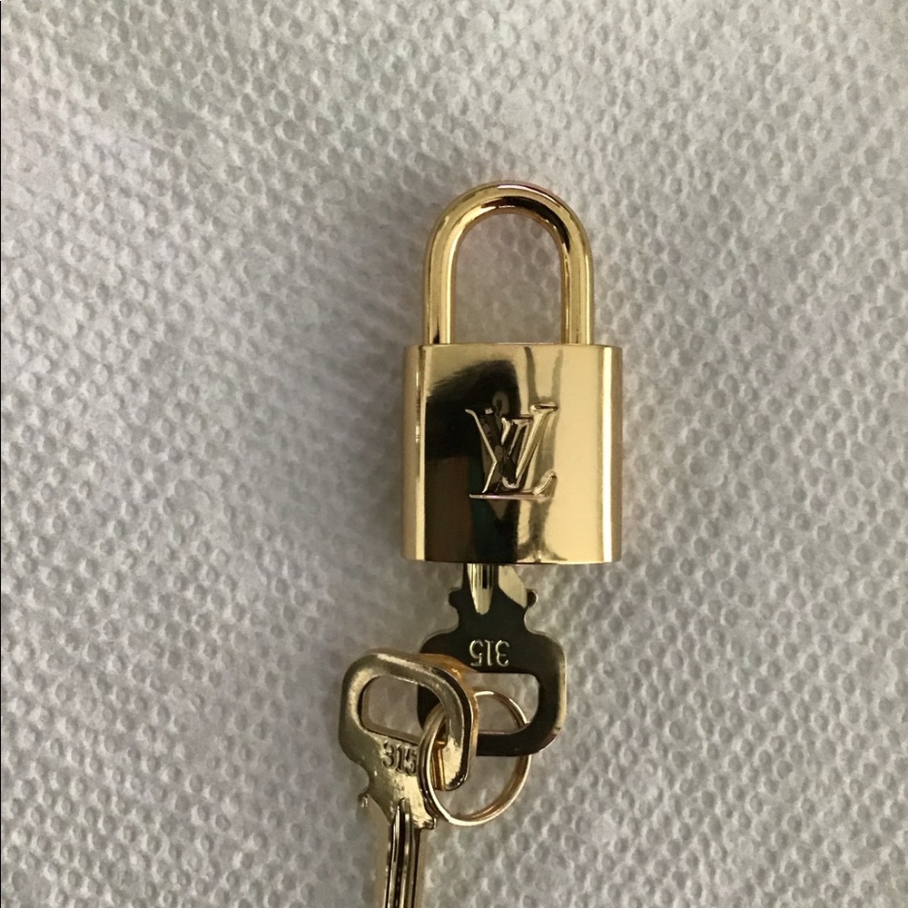 Louis Vuitton Gold Padlock and Key Set